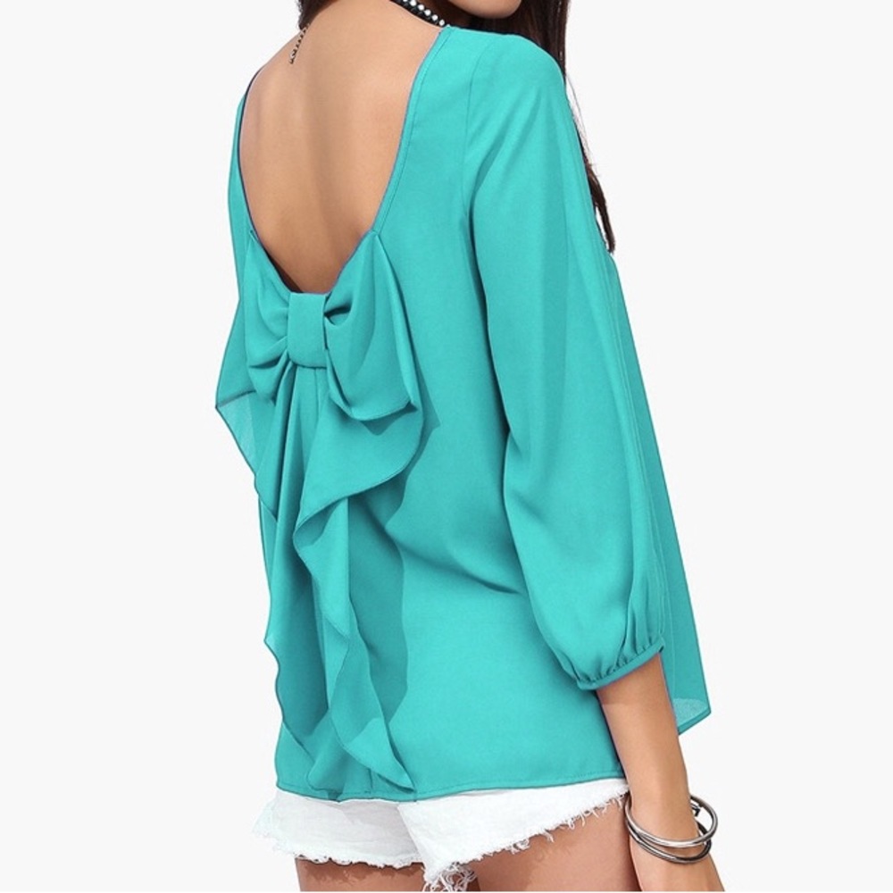 Boutique Turquoise Bow Back Blouse. Size small.